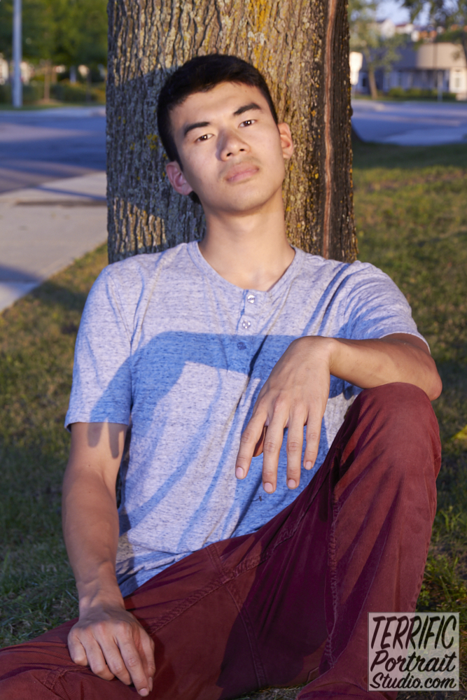 Franco Pang sitting against a tree at Terrific Portrait Studio, Ottawa by Jim Miles